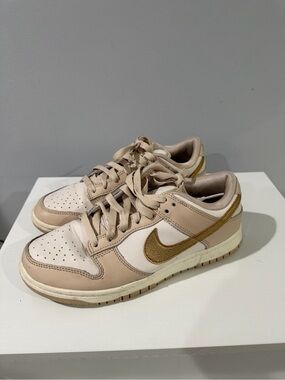 Nike dunks Women's Low-Top Sneakers in Beige with Gold Swoosh